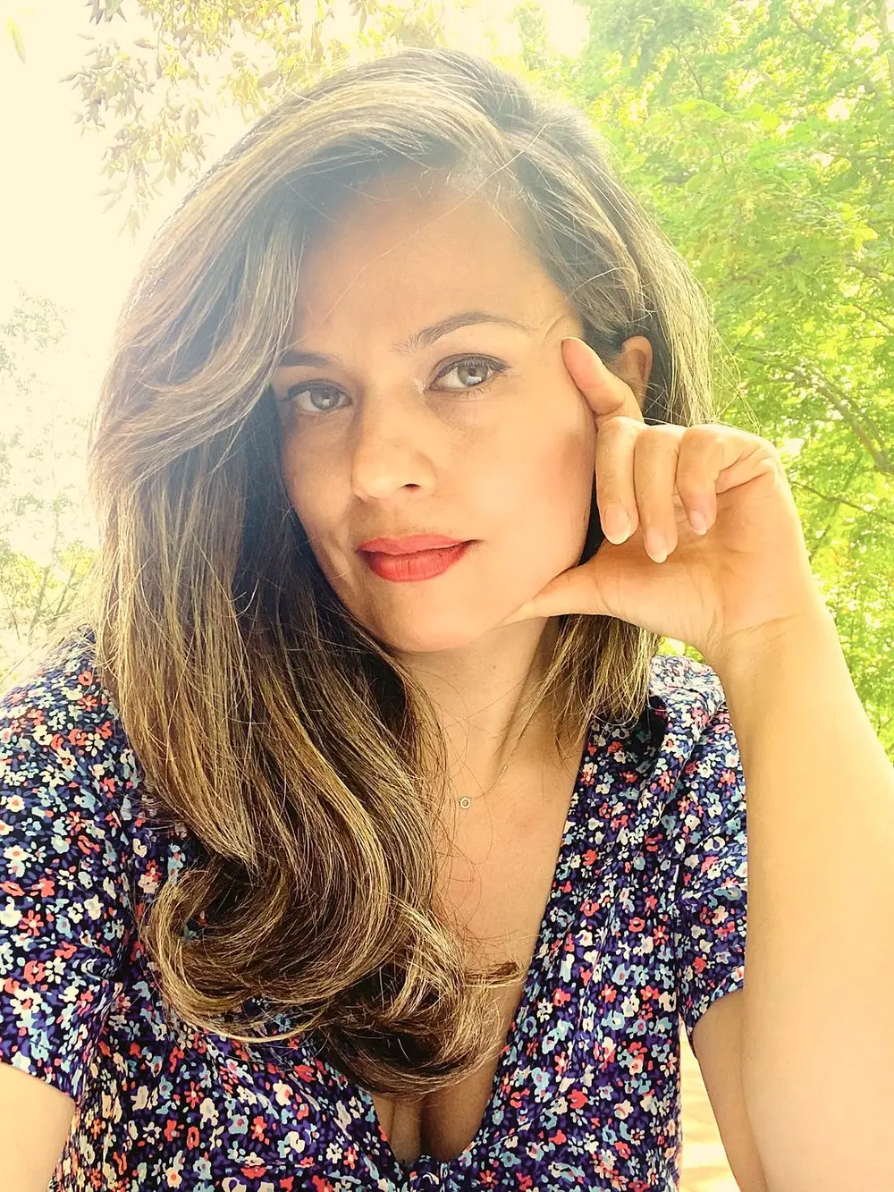 Portrait of Mariam van der Helm outside in warm light, looking into the camera